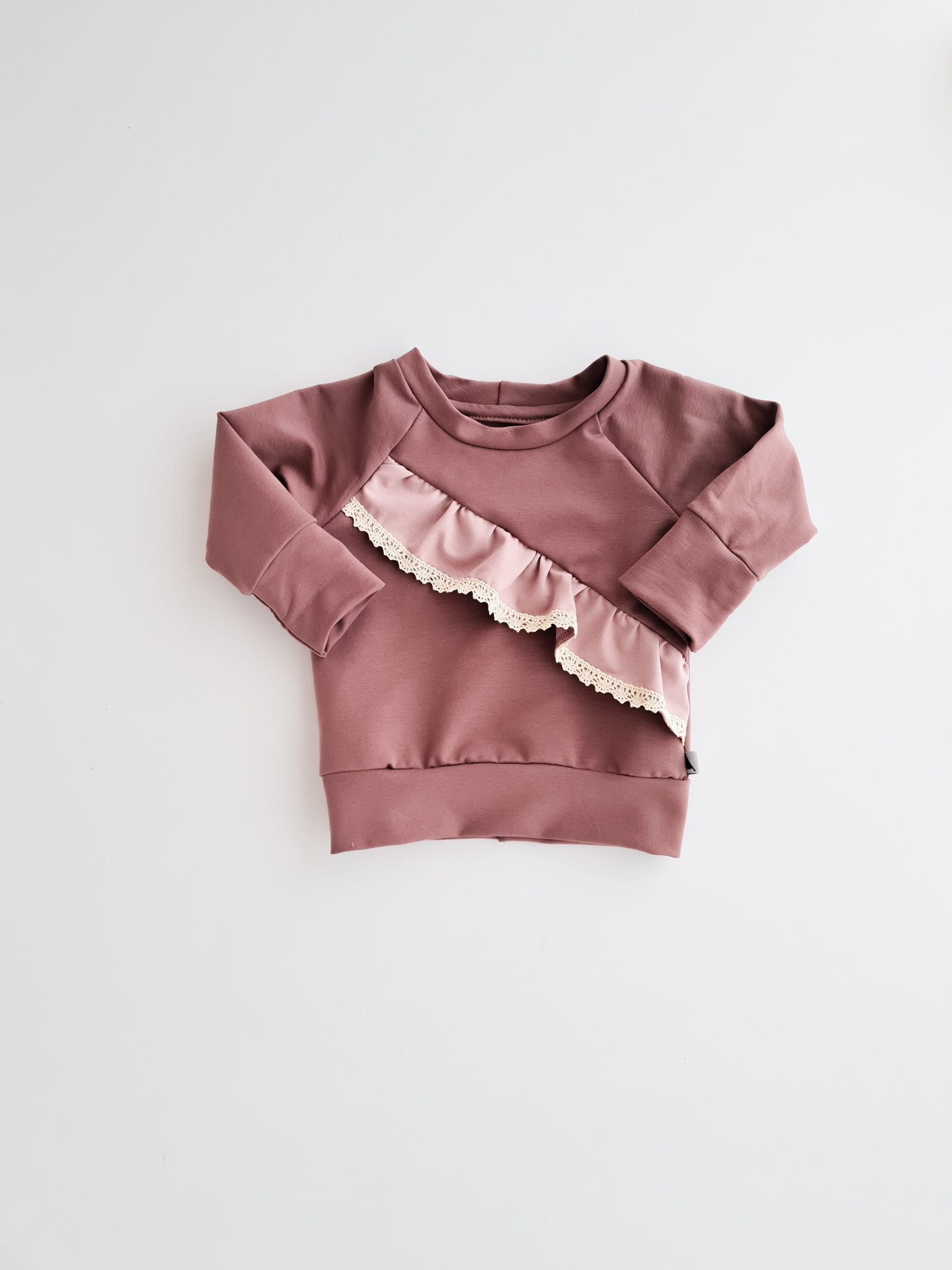 Pullover with slanted ruffle