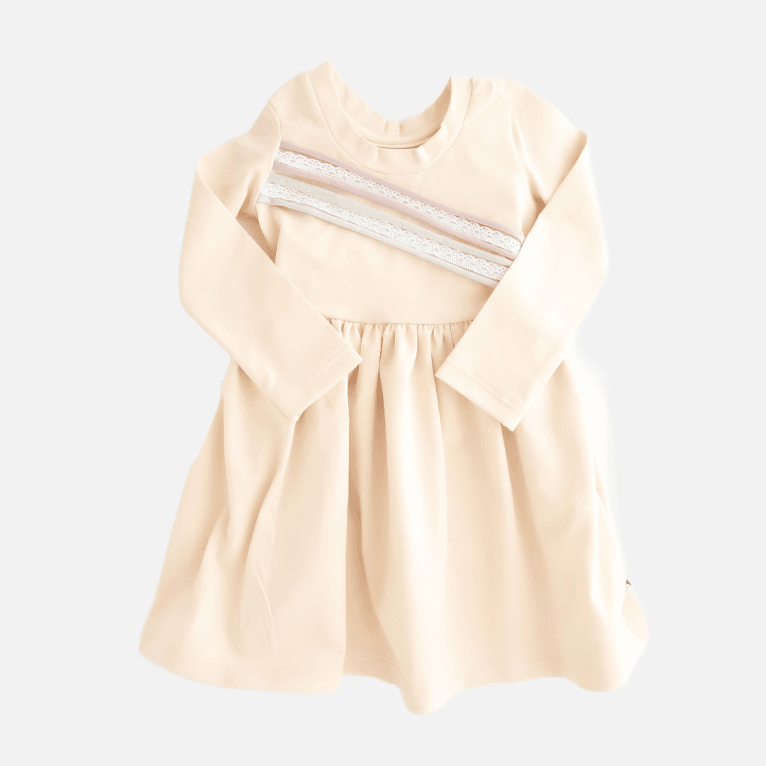 Beige dress with slanted stripes and lace