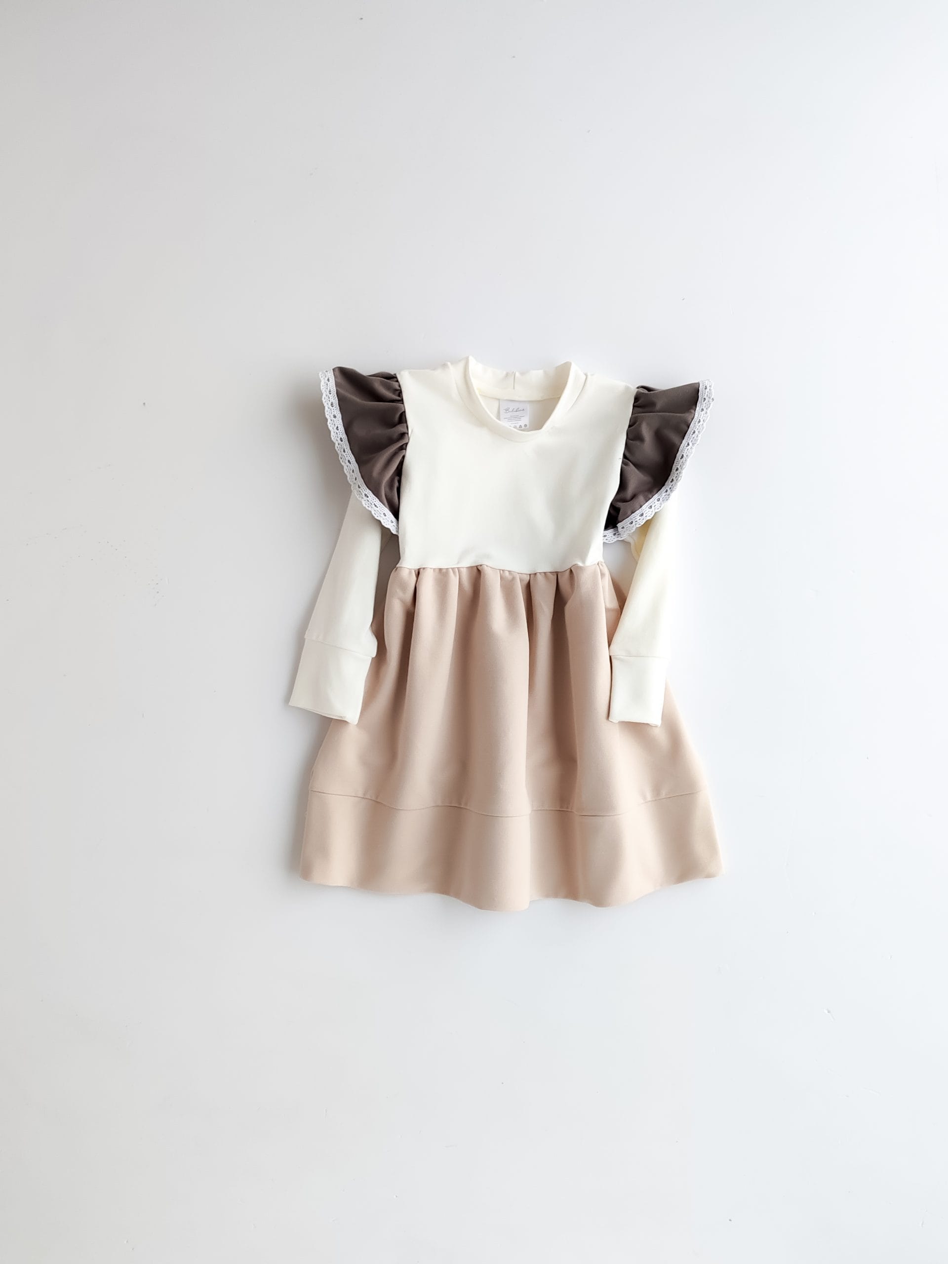 Beige-white dress with ruffles